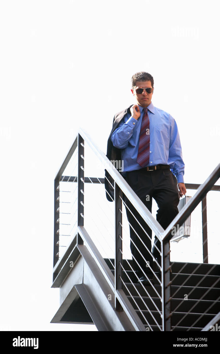 Young Man Walking Down Stairs High Resolution Stock Photography and