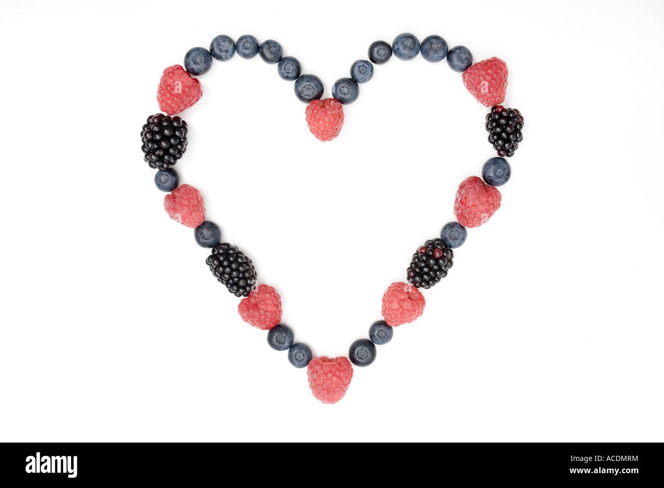 Berry heart made from English summer berries on a white background Stock Photo