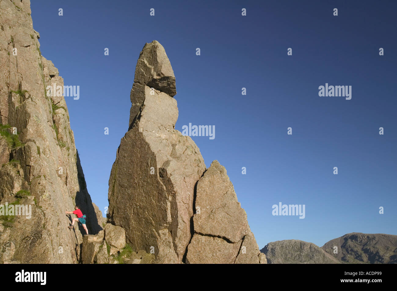 man climbing next to Napes Needle Great Gable Lake District Stock Photo