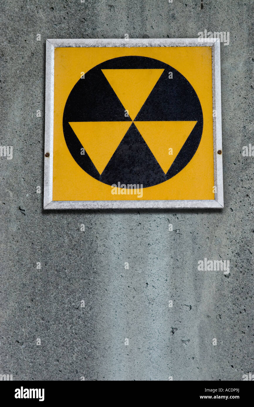 Radiation fallout shelter sign on concrete wall Stock Photo