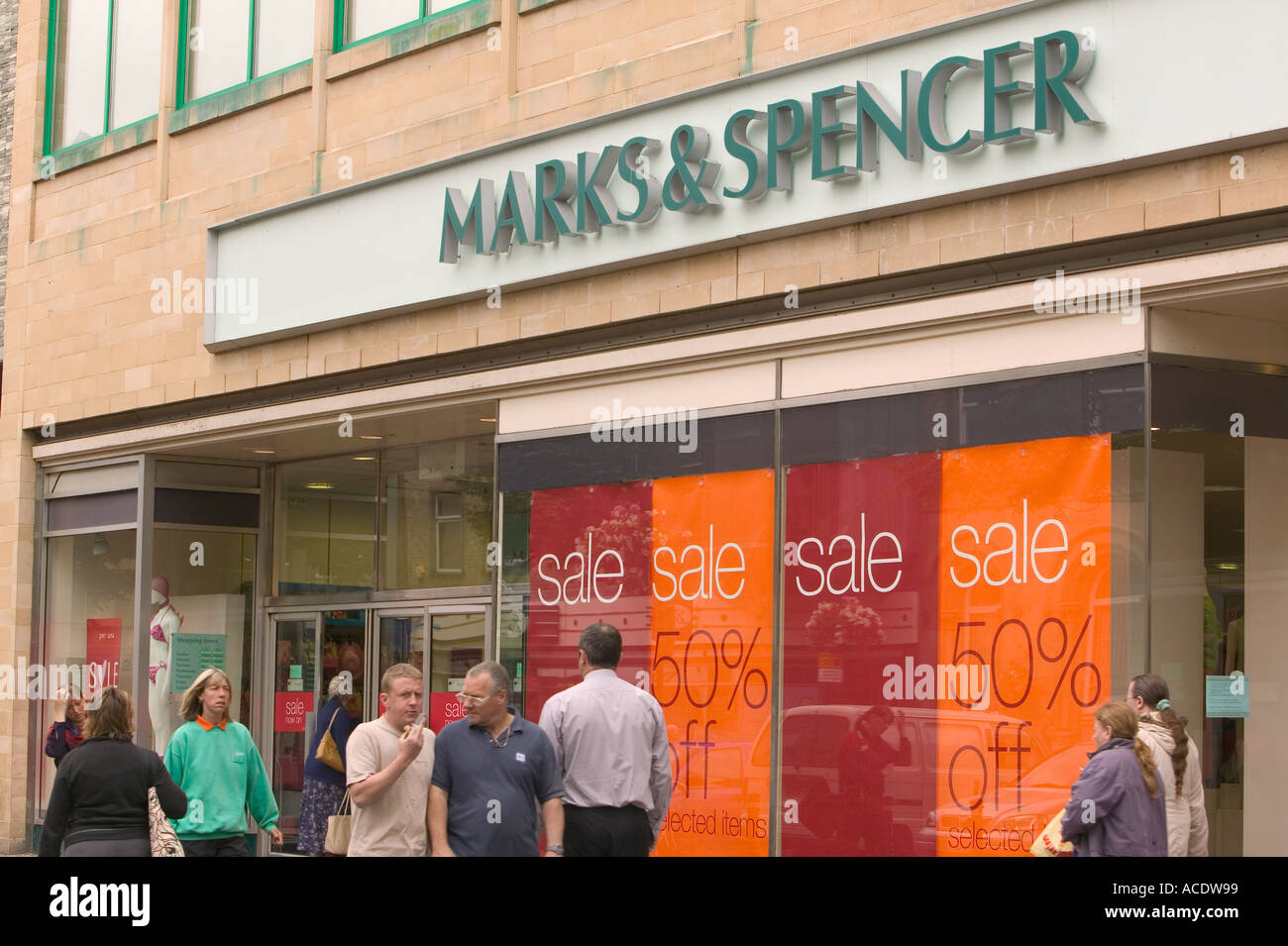 Shoppers Walking Past A Marks And Spencer S Store In Carlisle City Centre Stock Photo Alamy