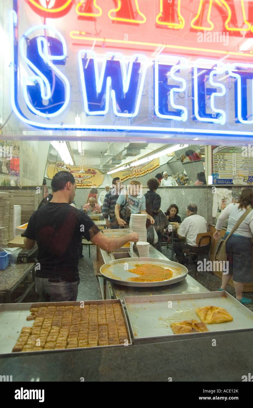 The Market Jerusalem old city Israel A store making and selling Knafeh a sweet cheese pastry
