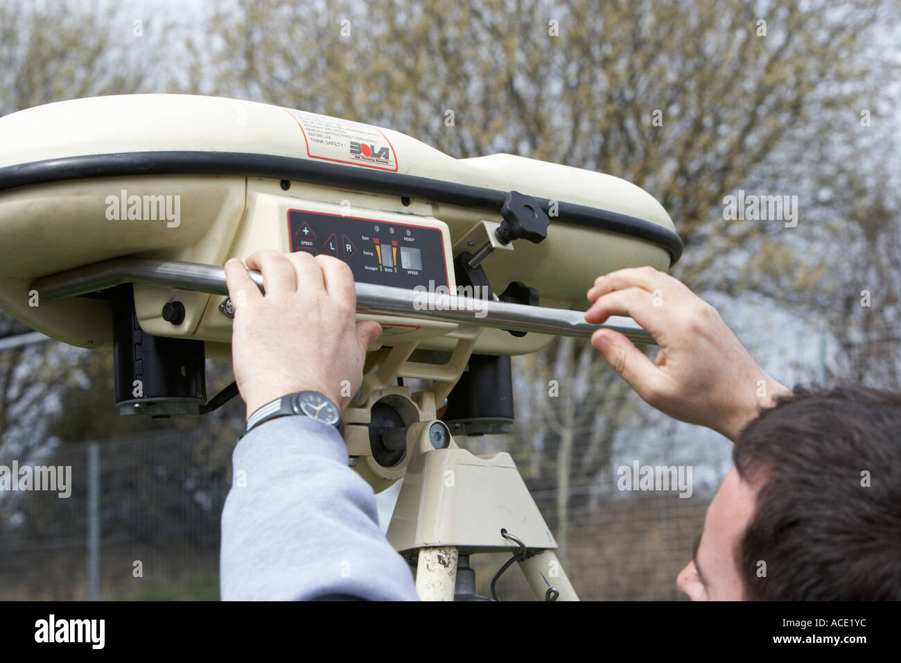using a bowling machine during cricket practice Stock Photo Alamy