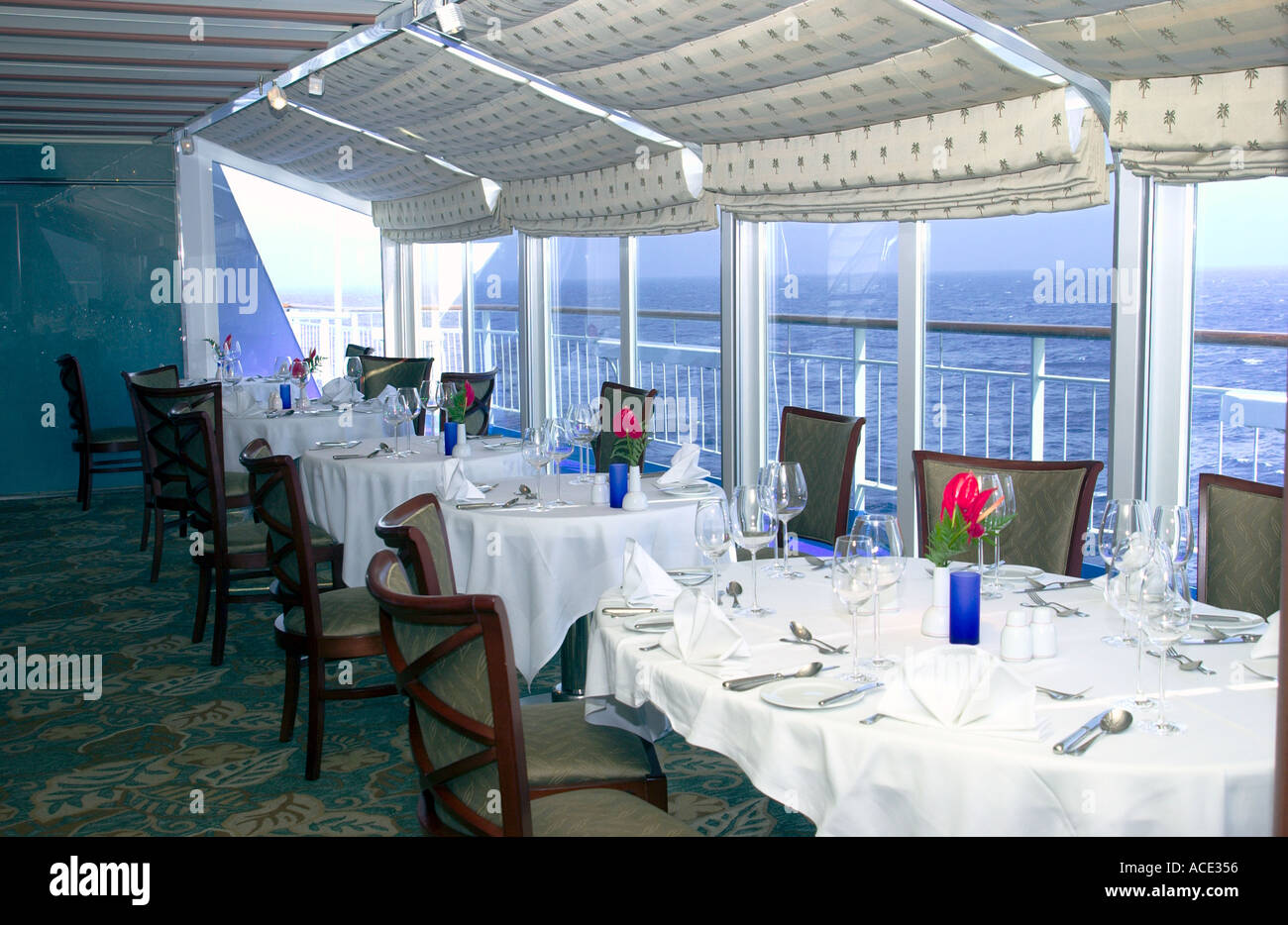 Restaurant table and chairs with table setting on the cruise ship the