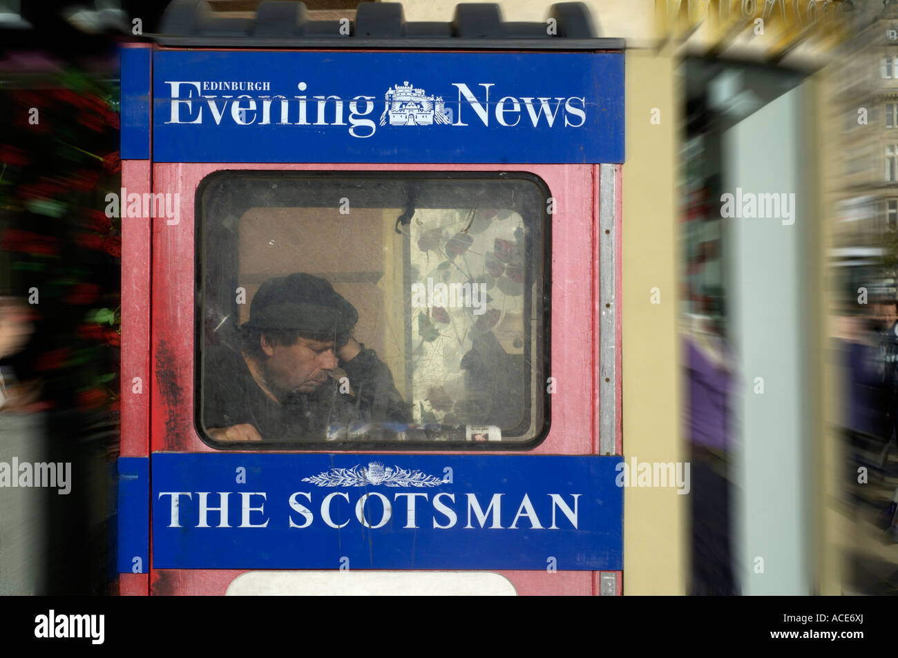 man selling the scotsman and evening news in edinburgh, scotland Stock Photo