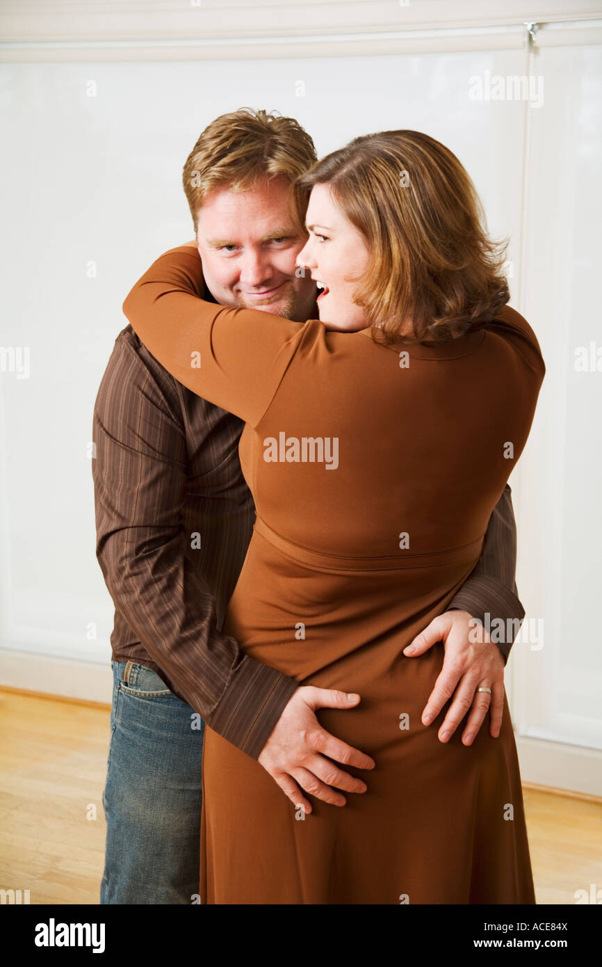 Man groping his wife Stock Photo - Alamy