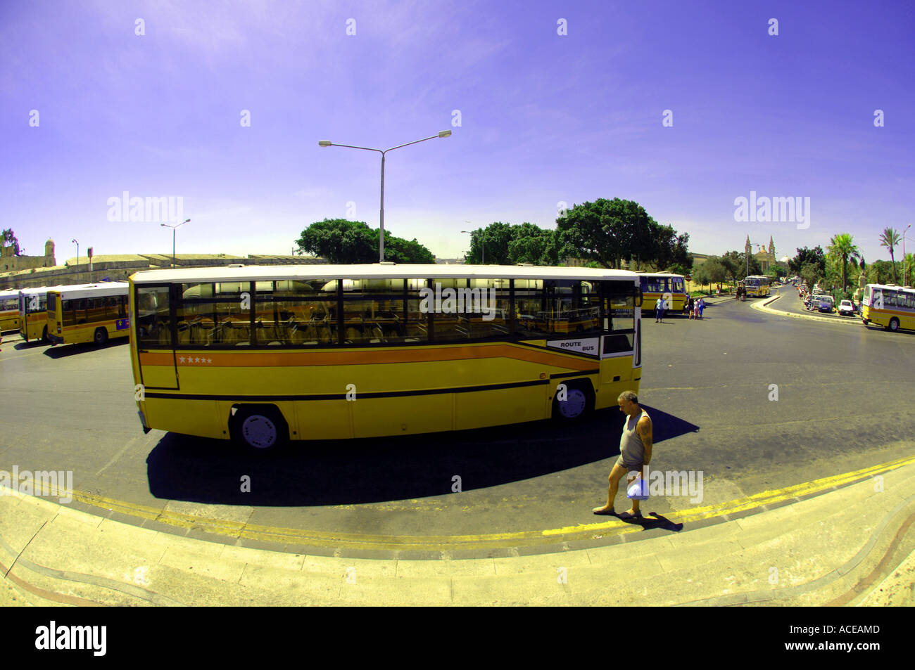 malta bus traditional yellow typical old fashioned valletta day daylight summer sunshine sun sunny atreeet urban city capital  m Stock Photo