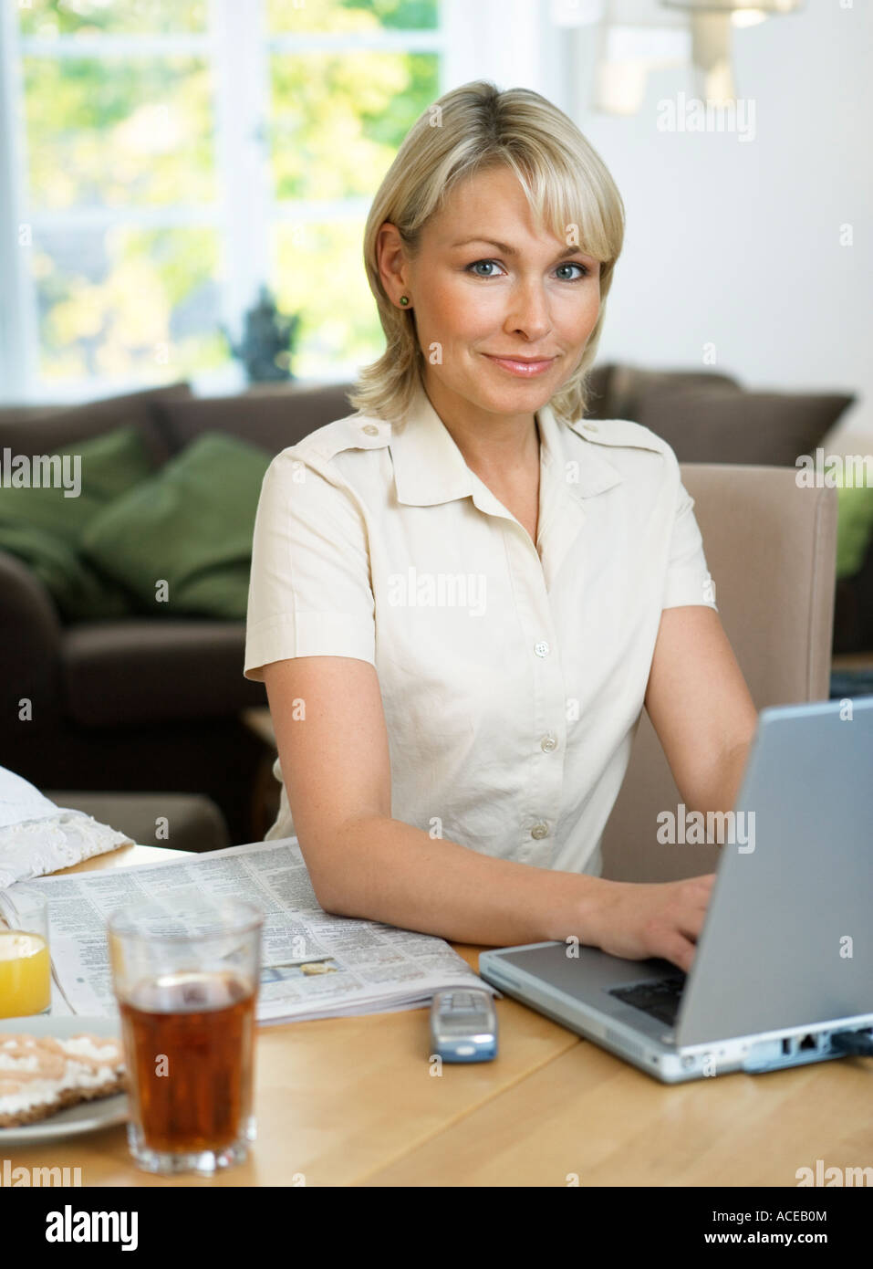 A woman working on a laptop at home Stock Photo - Alamy