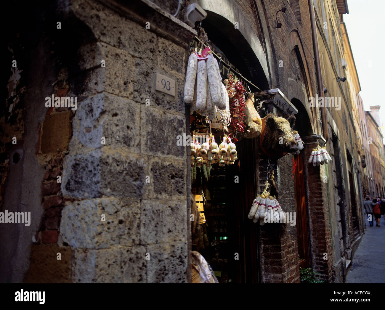 salami sausages and ham of wild boar in delicatessen shop city of siena region of tuscany italy Stock Photo