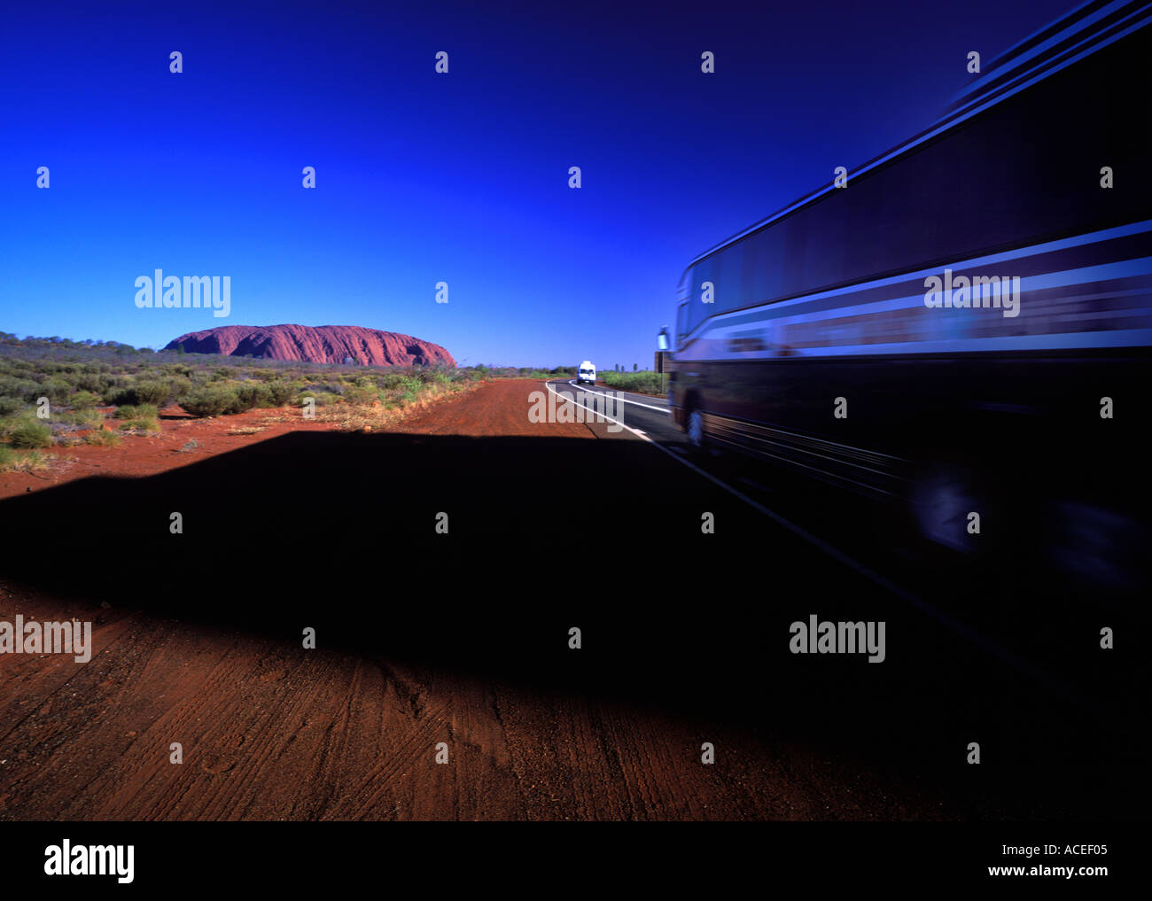 Tourist coach on the way to Uluru or Ayers Rock Northern Territory Australia Stock Photo