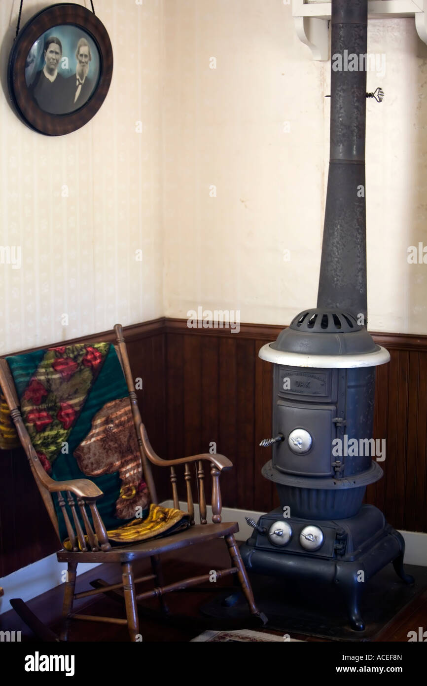 Pioneer potbelly stove rocking chair livingroom Stock Photo Alamy