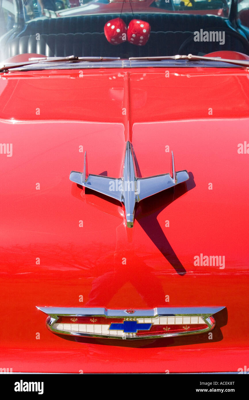Front Of A Red Chevrolet Bel Air Convertible Classic Car With Emblem Hood Ornament And Fuzzy Dice Hanging In The Windshield Stock Photo Alamy