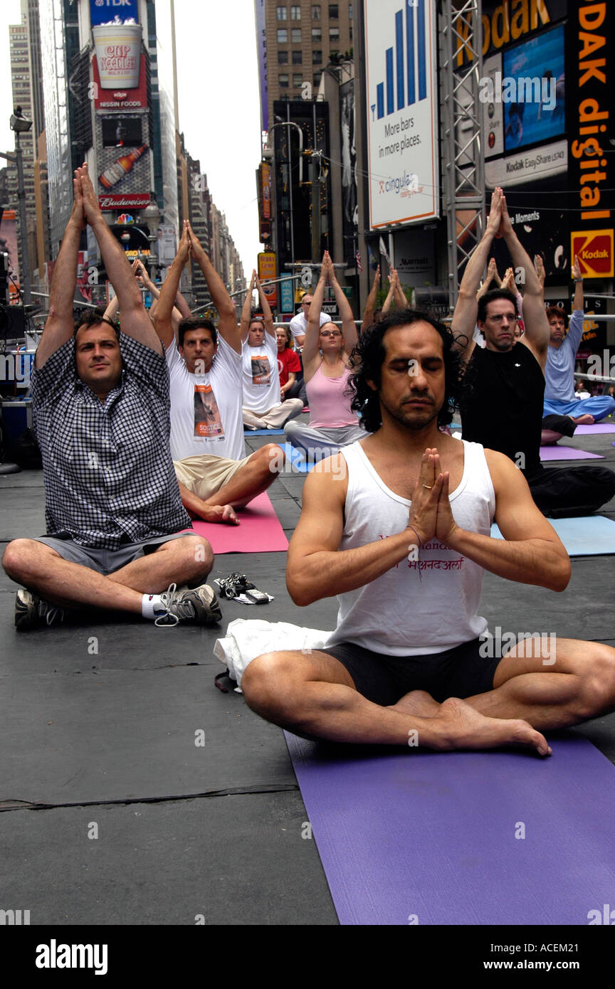 Yoga practitioners gather in Times Square Stock Photo - Alamy