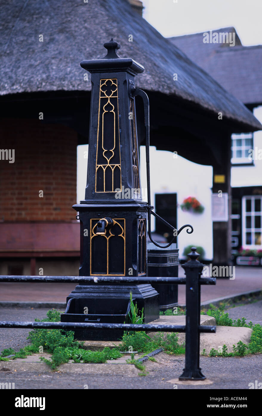 Unique gothic style cast iron pump in the village square Houghton village Cambridgeshire Stock Photo