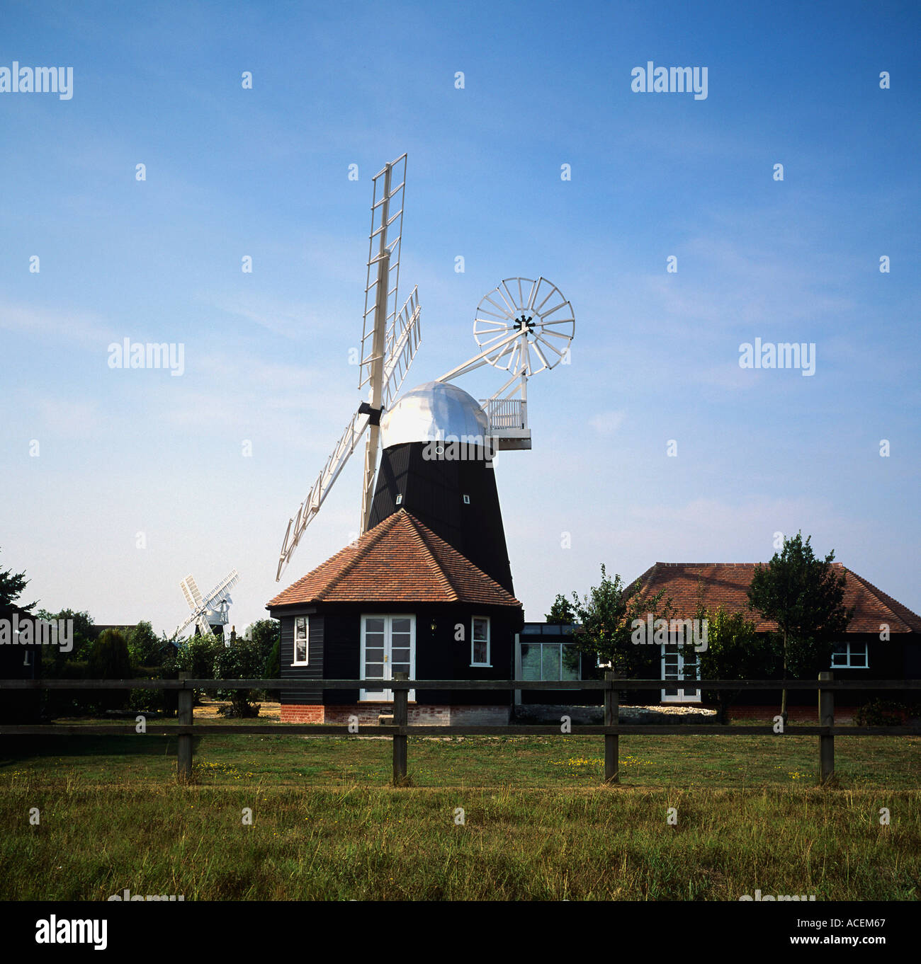 Tower Windmill restored 1993 Foreground mill part of a home mill restored to working order Swaffham Prior Stock Photo