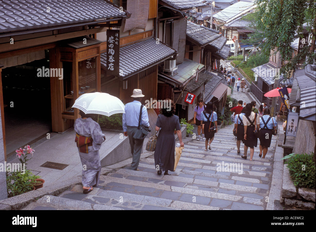 Famous cobblestone Sannenzaka street in Kyoto lined with traditional shops and restaurants attracting many tourists Stock Photo