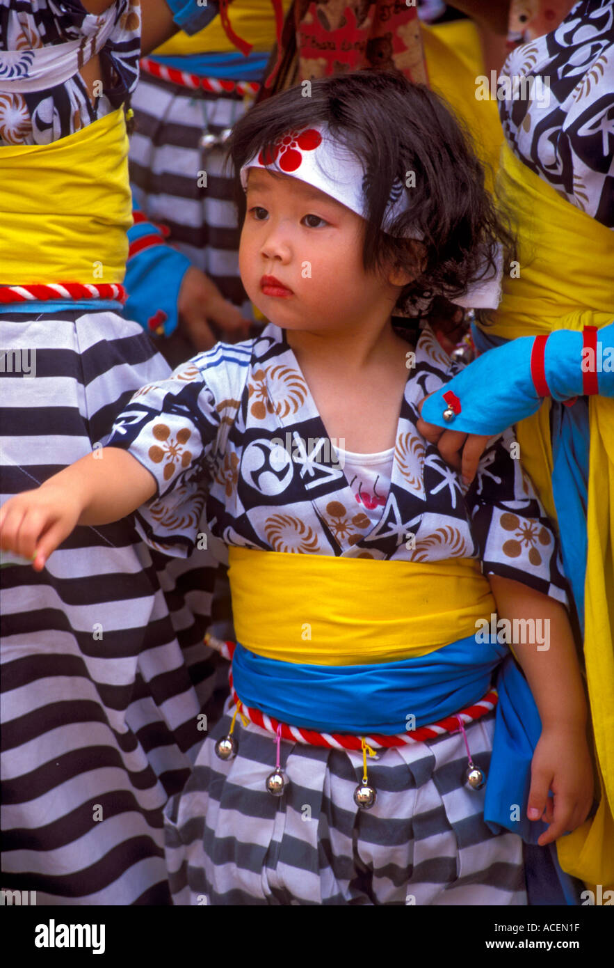 Little girl in festival costume blends in with her background at the Osaka Tenjin Matsuri Festival Stock Photo