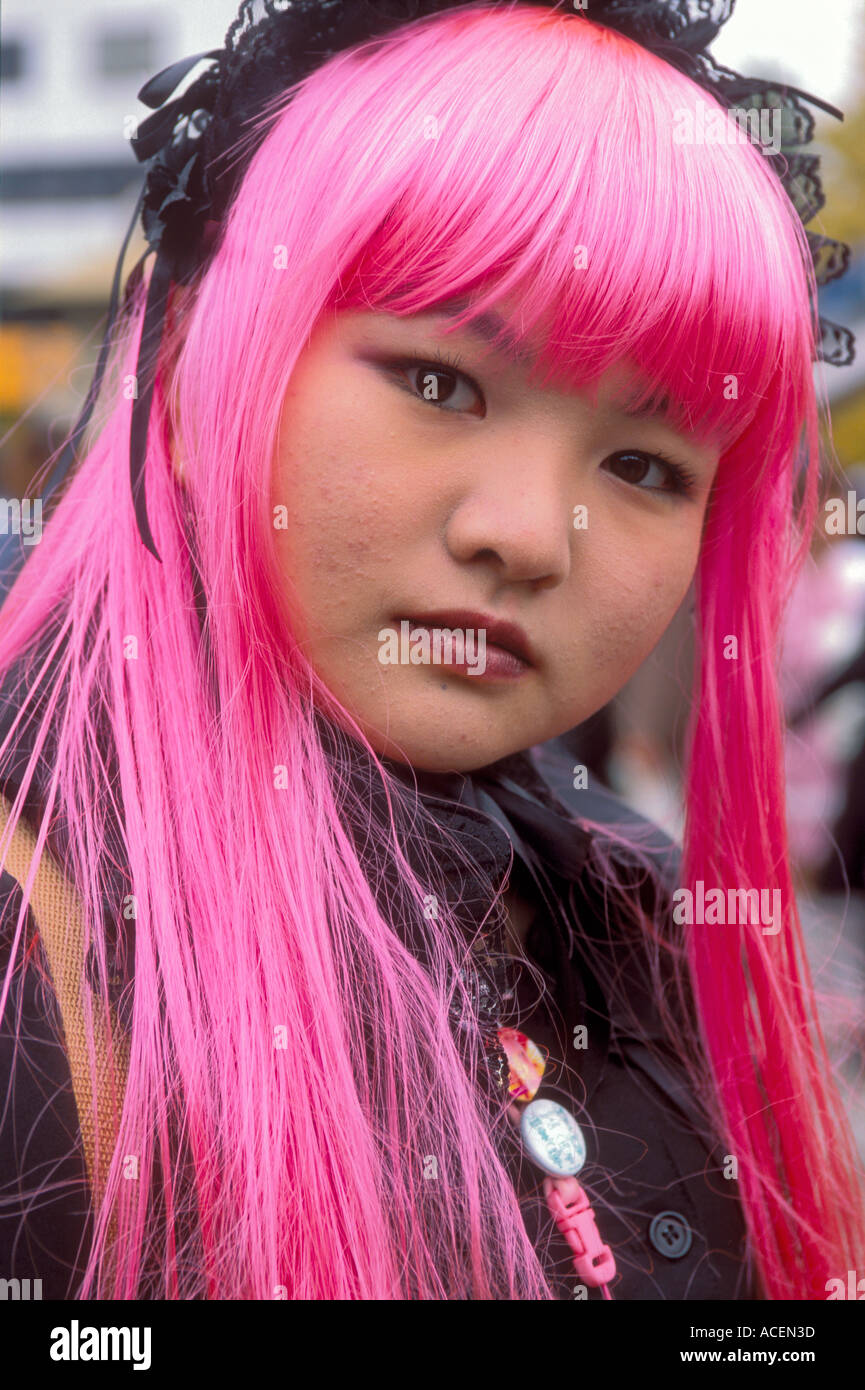 Teenage girl with pink plastic hair participates in the costume play at Harajuku Tokyo Stock Photo