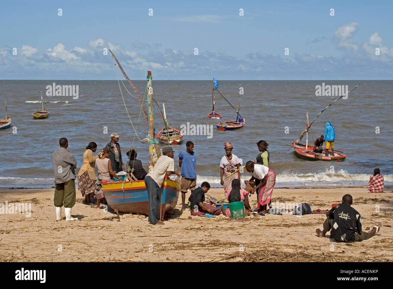 Fishermen with their families on the beach at costa do sol, maputo ... Costa do sol