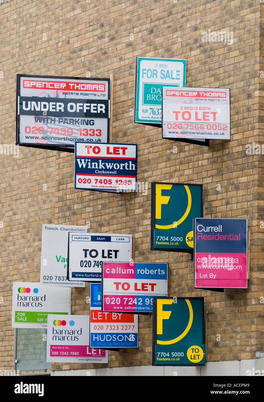 Estate Agent signs on side of building, Farringdon, London, UK. Stock Photo