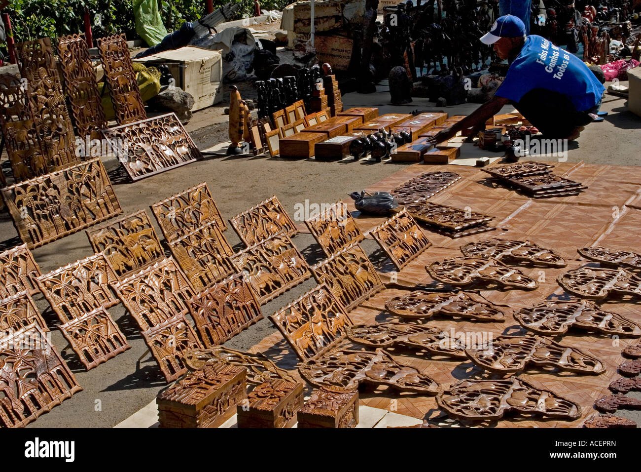 Vendor setting up his stall of woodcarvings, Saturday craft market, Maputo, Mozambique, Southern Africa Stock Photo