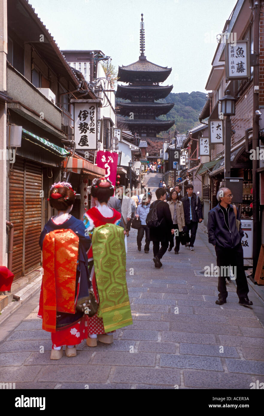 Two maiko or geisha in training strolling along a backstreet in Kyoto Stock Photo