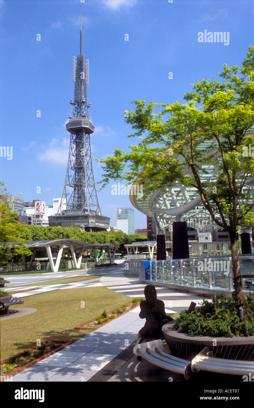 Woman relaxing in city park near Nagoya TV tower on sunny day in the Sakae business district Stock Photo