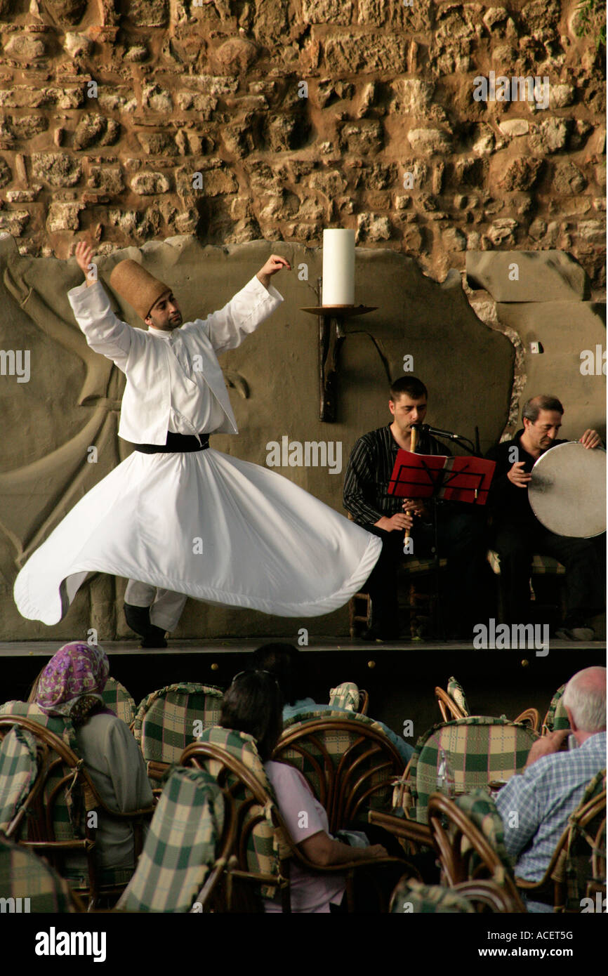 Whirling dervish at a cafe in Istanbul Turkey Stock Photo