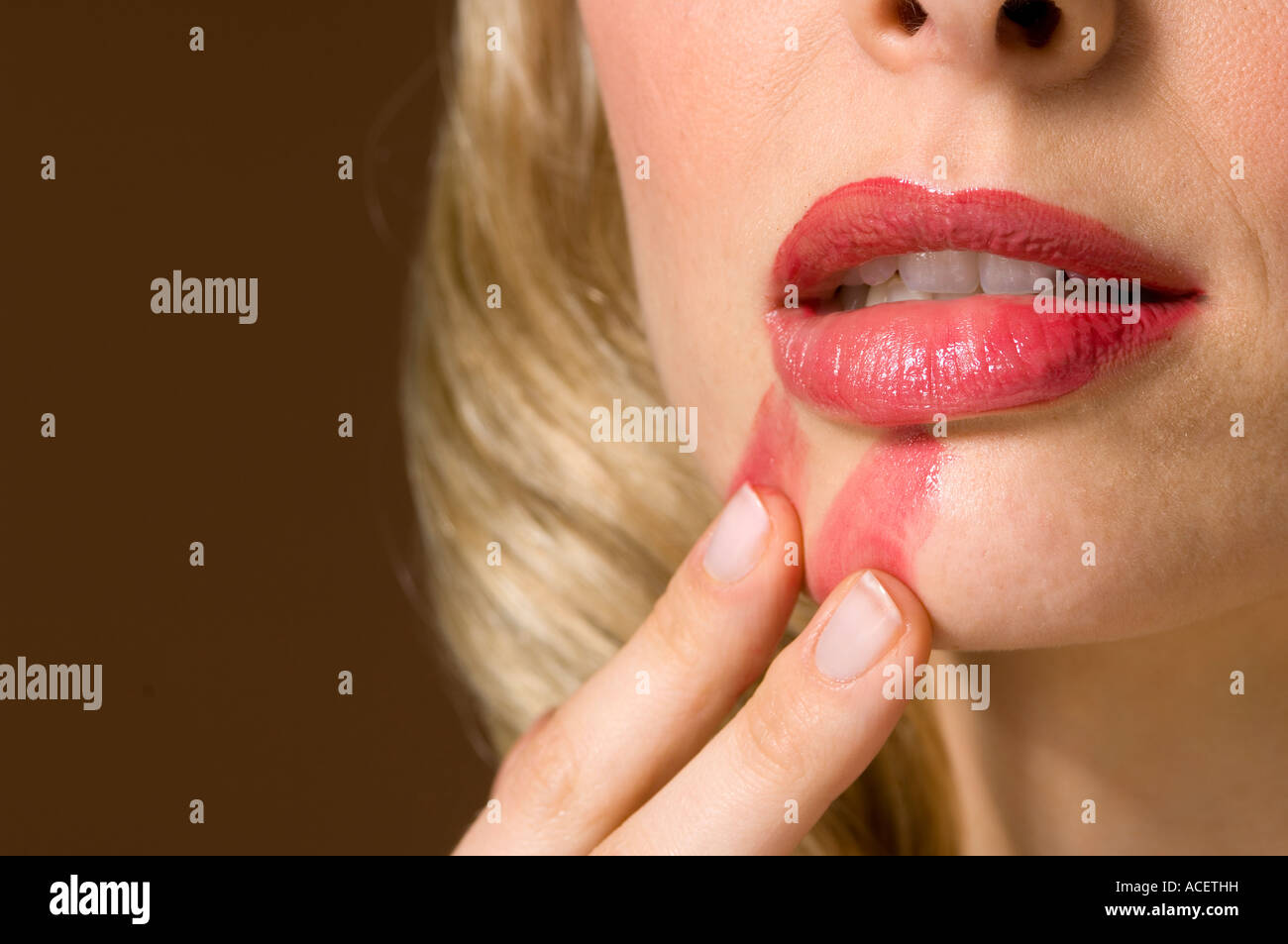 lady/ girl smudged lipstick Stock Photo