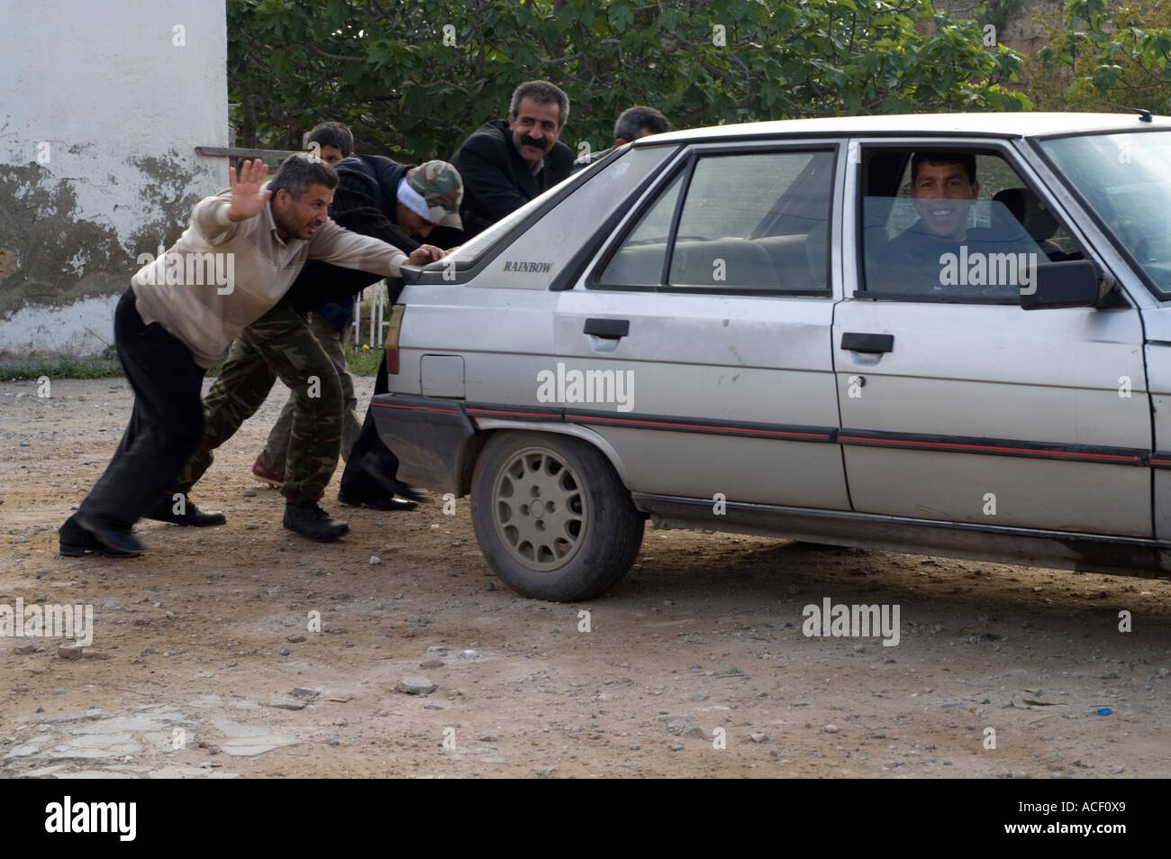 Pushing a car, neighbourly help, Guzelyurt, Northern Cyprus, Mediterranean, Europe Stock Photo