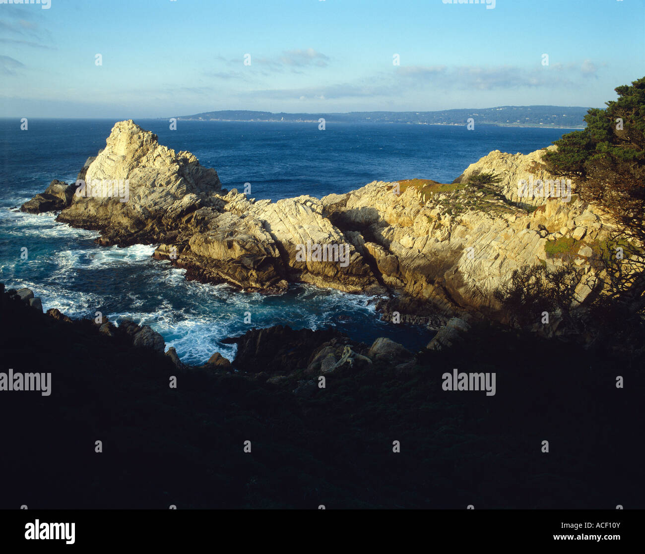 Large rocks shoreline waves crash Stock Photo - Alamy