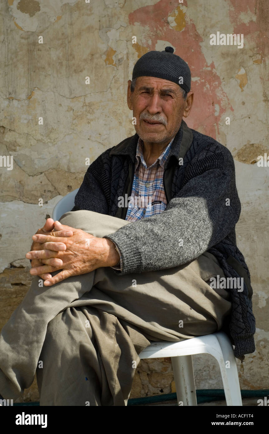 Man sitting, Zigamet, Ziyamet village, Northern Cyprus, Mediterranean, Europe Stock Photo