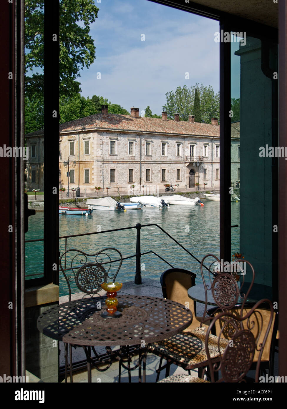 Romantic corner in a cafe in the old historic town of Peschiera del Garda Garda lake region Italy Stock Photo
