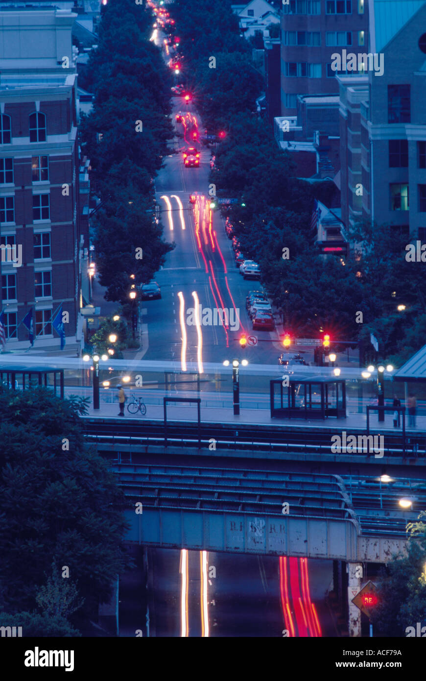 Evening traffic on King St passes beneath the King Street Metro Station