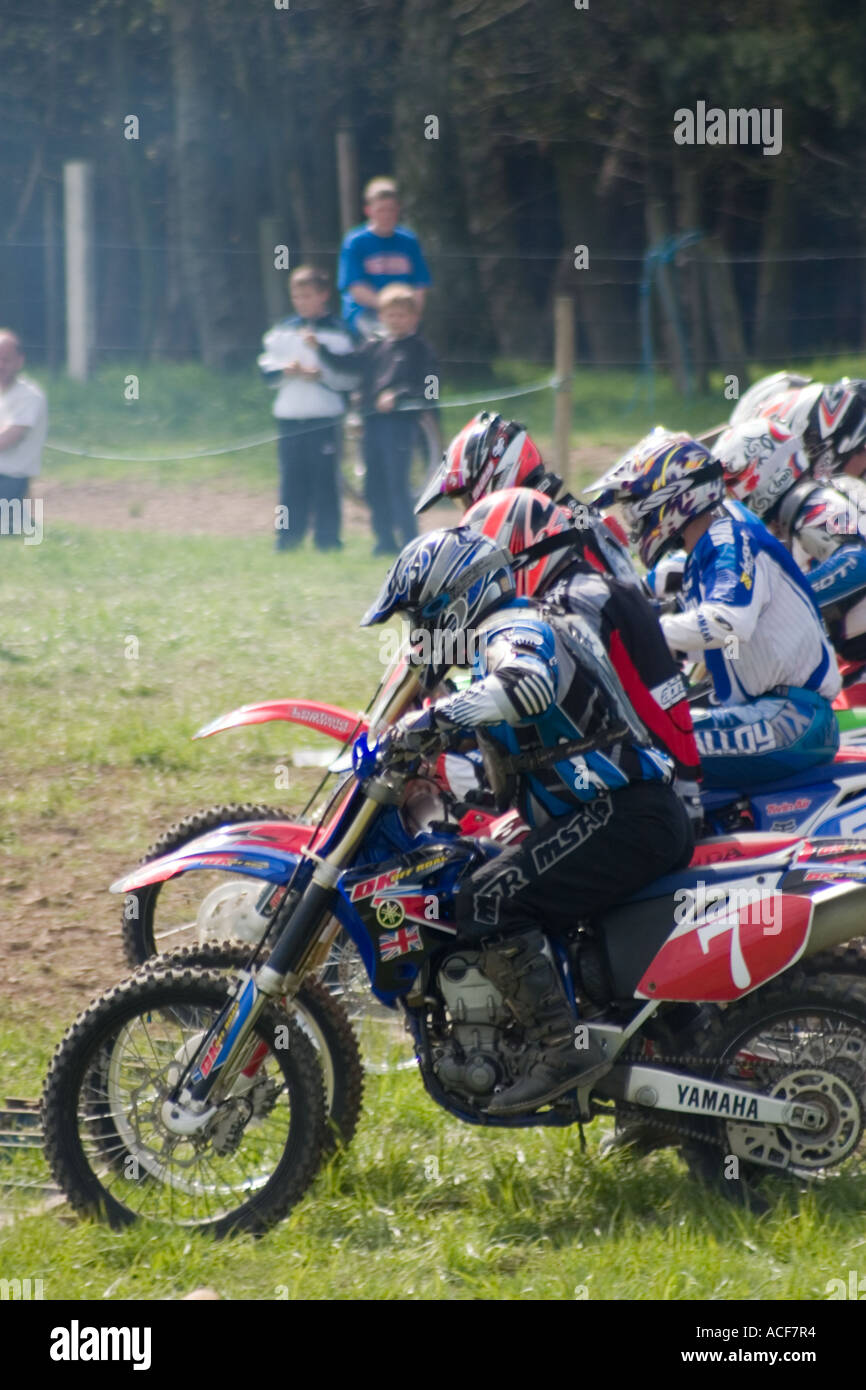 Bikes and riders setting off at start of Motocross race Stock Photo Alamy