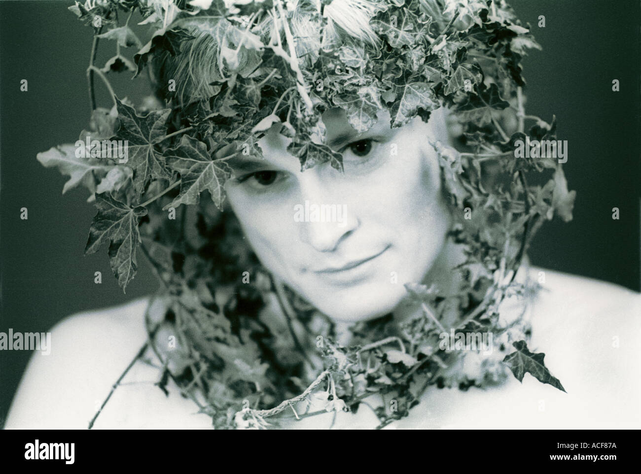 Young man wearing a crown of ivy London Stock Photo