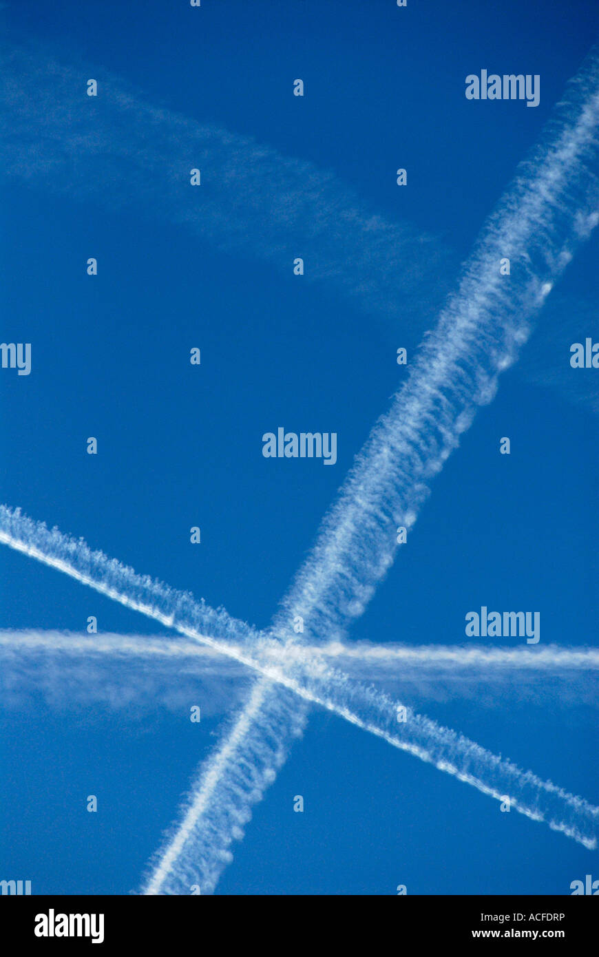 Contrails of some airplanes in blue sky Stock Photo