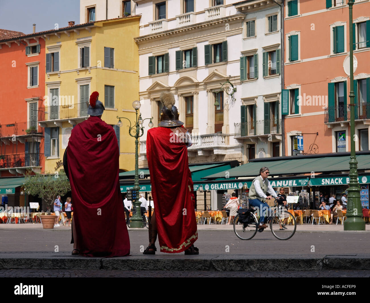 Roman legionaires gladiators waiting for tourists to entertain on Piazza Bra Verona Italy Stock Photo