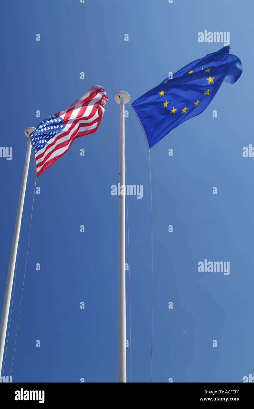 US and EU flags flying side by side in a blue sky Stock Photo - Alamy