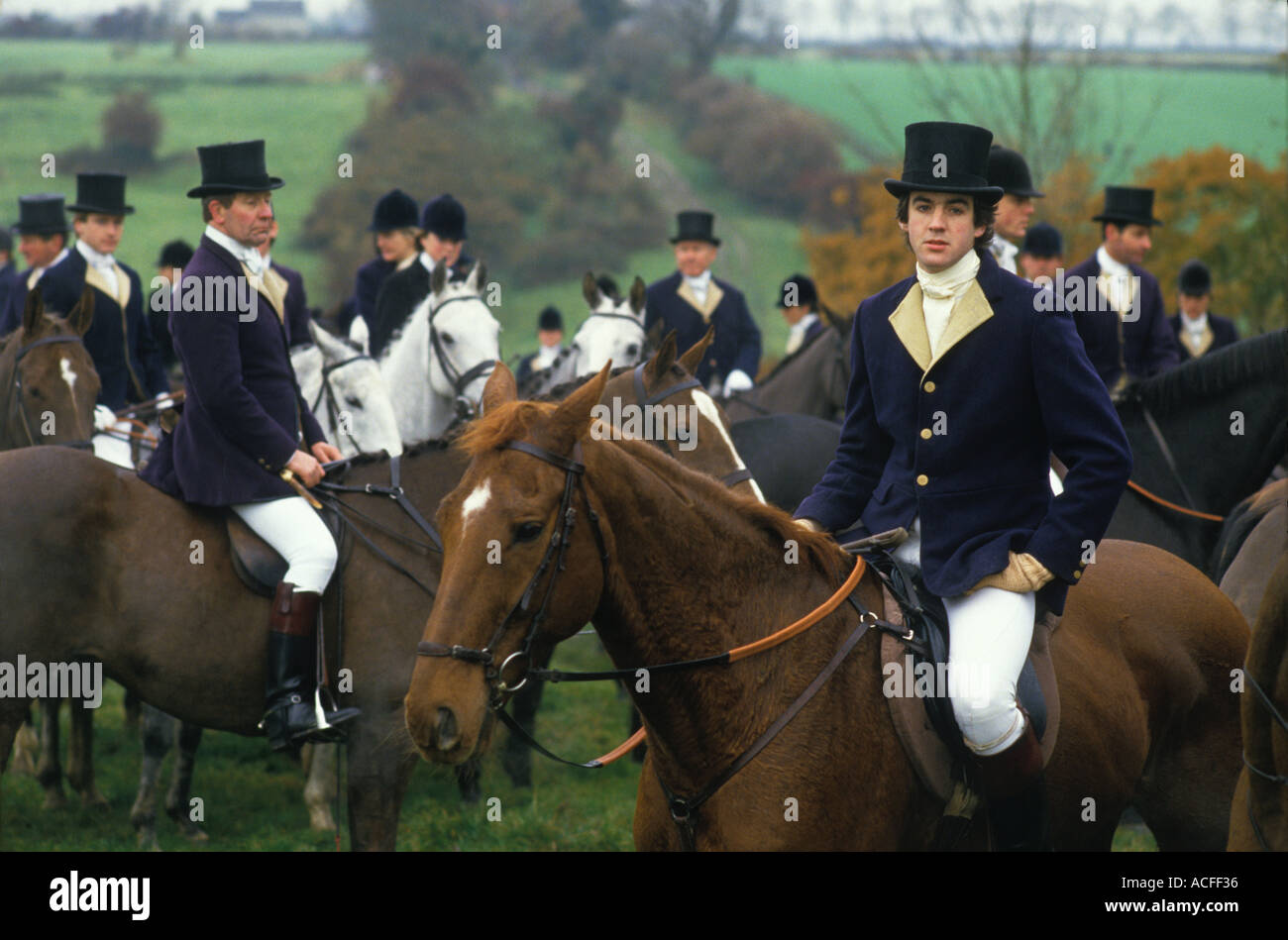 Duke of Beaufort Hunt Badminton  Gloucestershire Group of men wearing traditional Blue and Buff top coats and black top hats 1980s 1985 HOMER SYKES Stock Photo