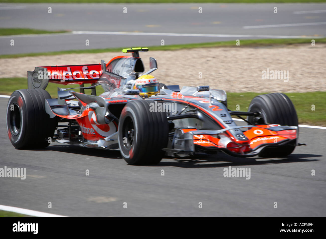 lewis-hamilton-driving-his-mclaren-mercedes-forumla-one-racing-car-to