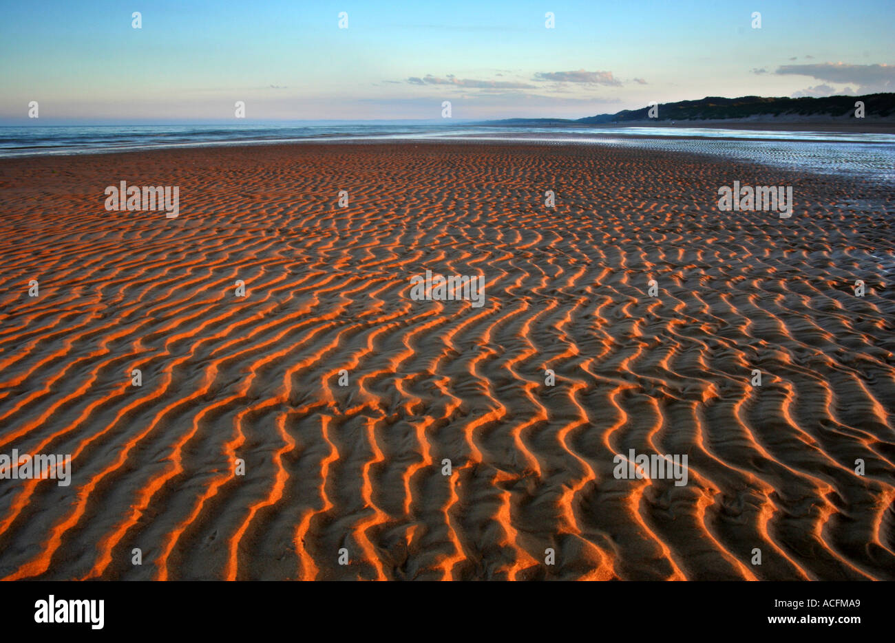 Hypnotic patterns in the sand intensified by the setting sun at Balmedie beach north of Aberdeen landscape format Stock Photo
