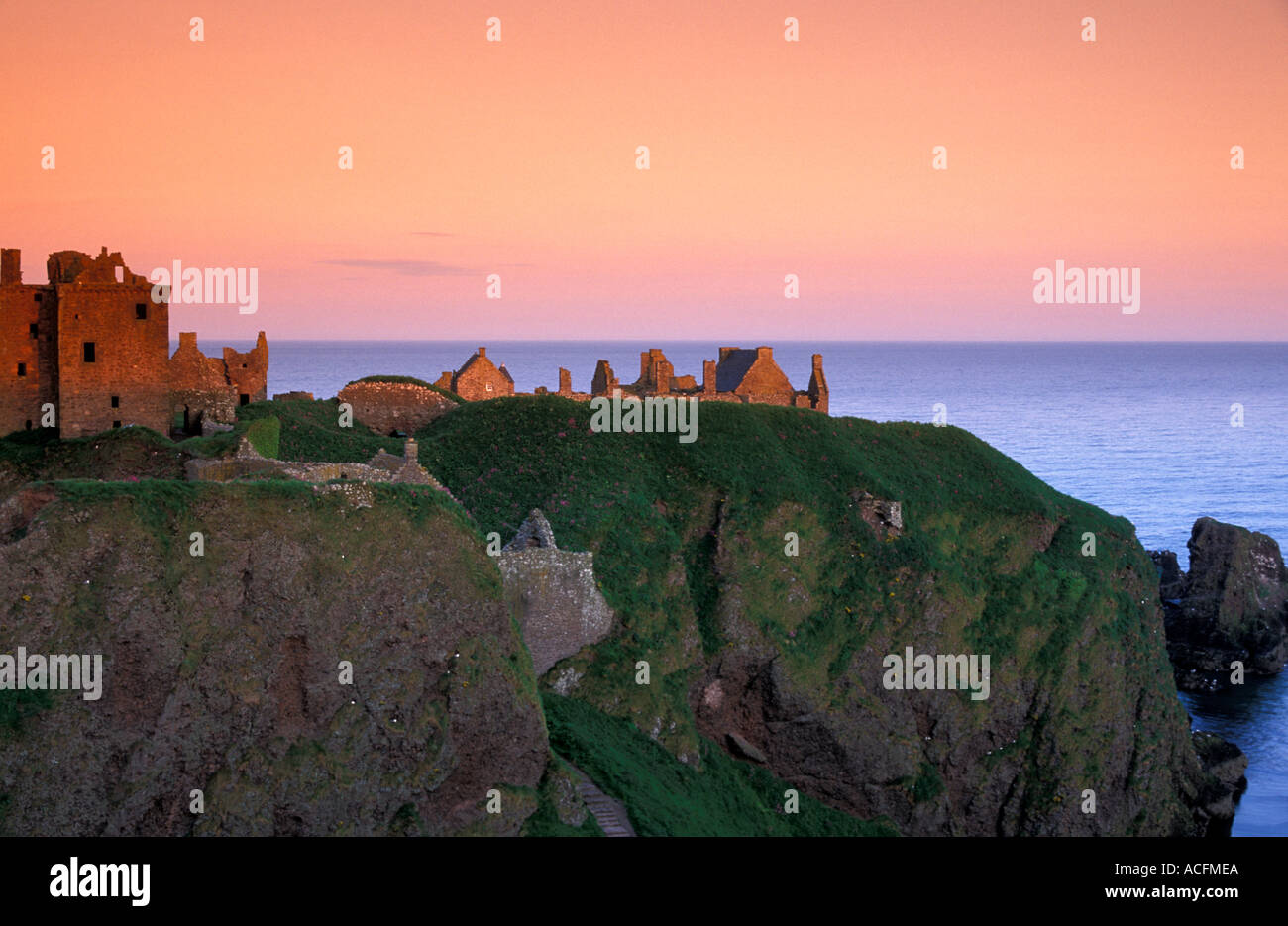 Dunnottar castle near Aberdeen orange winter sunset in landscape format Stock Photo