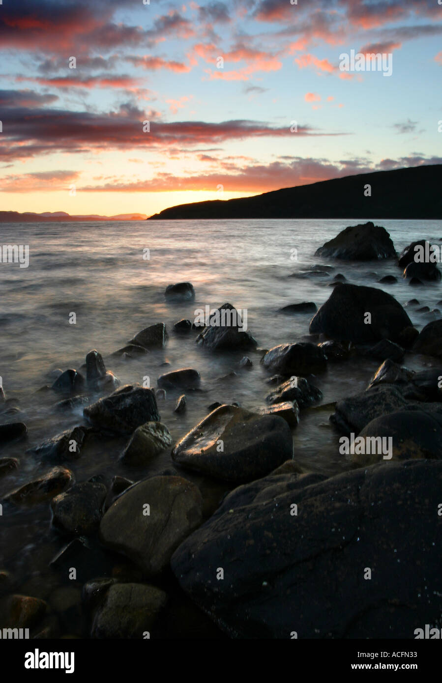 Summer sunset looking out towards Isle of Skye from Applecross in portrait format Stock Photo