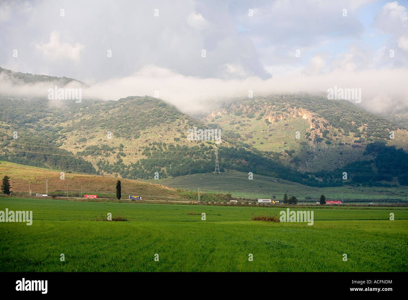 Fields in Izrael Valley When the clouds touch the Carmel ridge Stock Photo