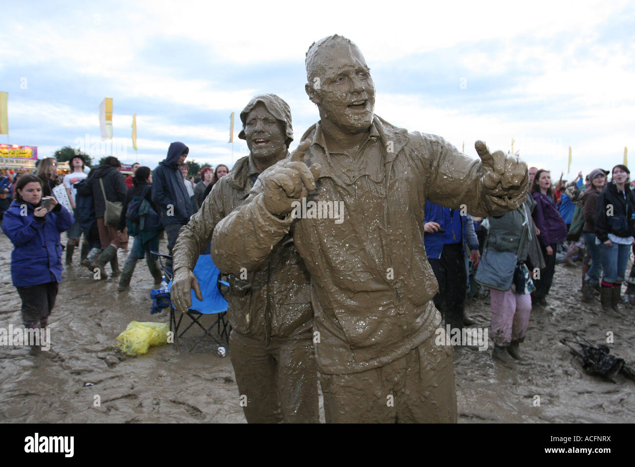 Two guys covered in mud at the Glastonbury Festival 2007. Stock Photo