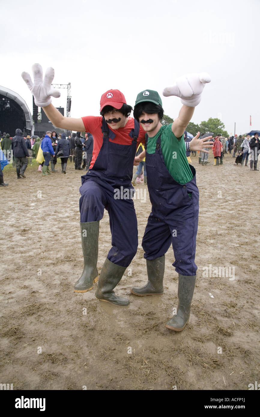 Two happy guys dressed in super mario brothers fancy dress at the Glastonbury festival 2007 Stock Photo
