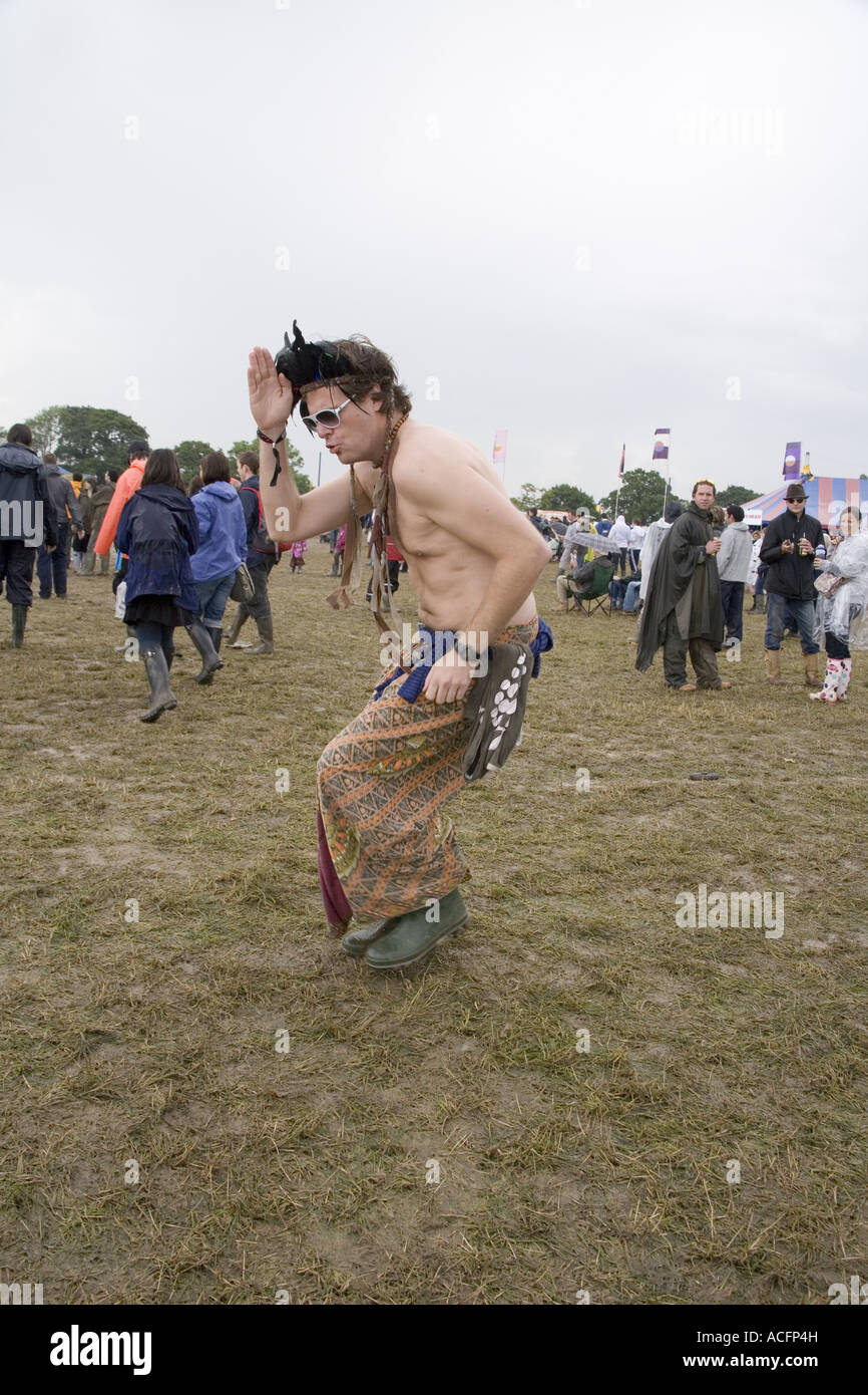 A man dressed in a skirt, dancing in a native American style at the Glastonbury festival 2007 Stock Photo