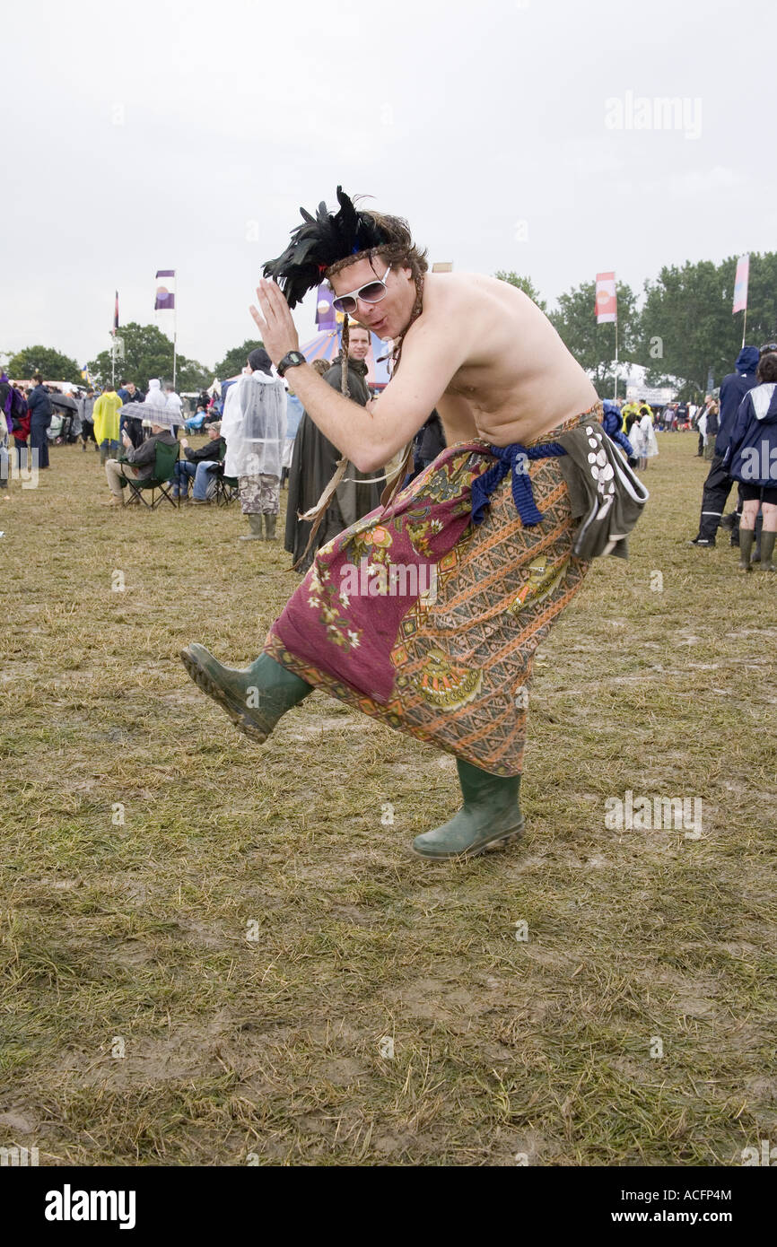 A man dancing in a dress at the Glastonbury festival 2007 Stock Photo