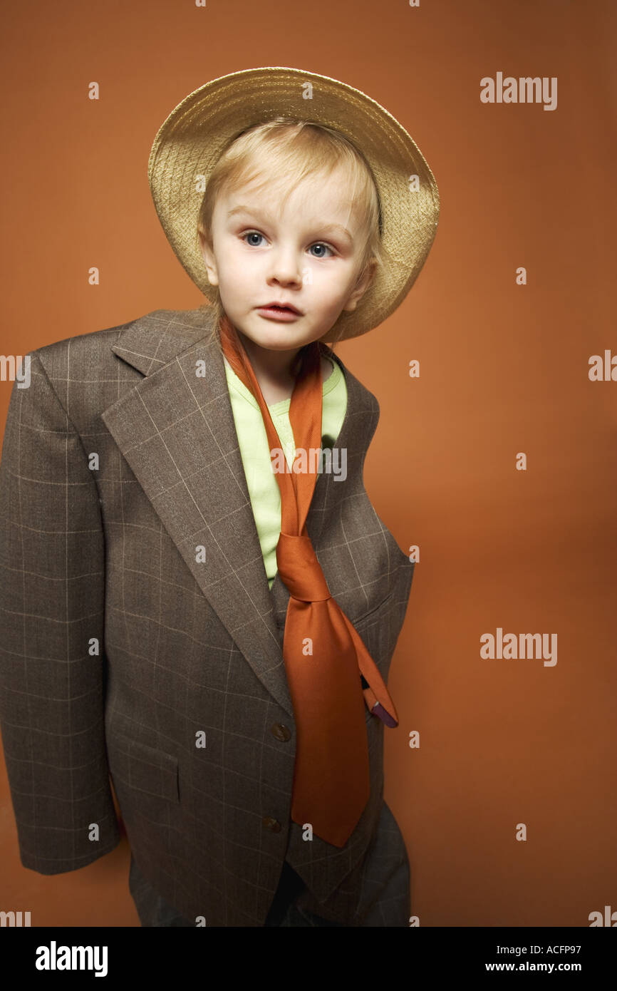 Young child dressing up in suit Stock Photo Alamy